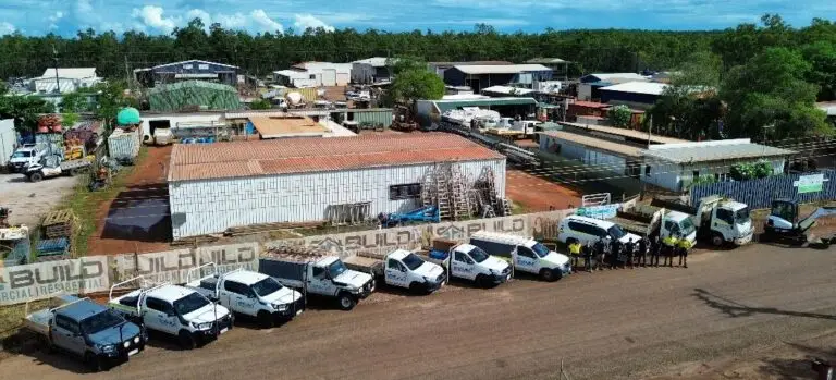 Aerial view of construction site with vehicles.