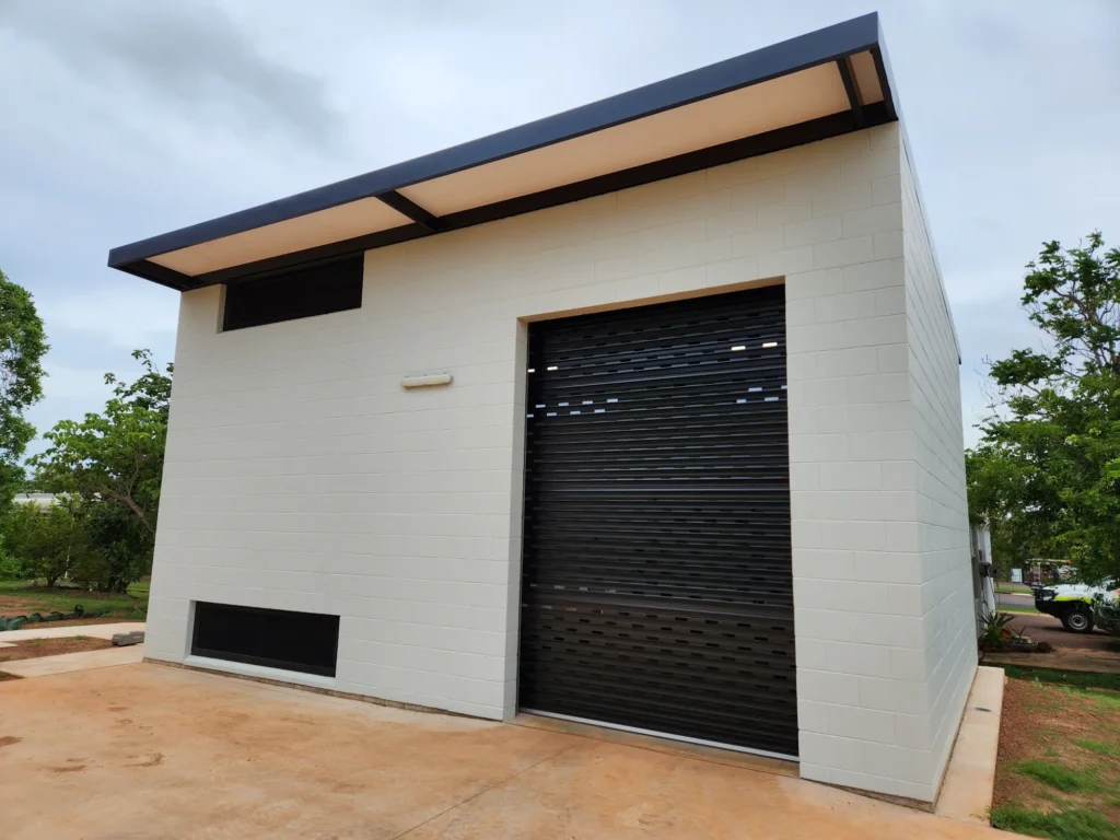 Modern building with black roller door