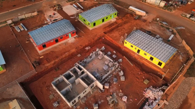Aerial view of colourful buildings under construction.