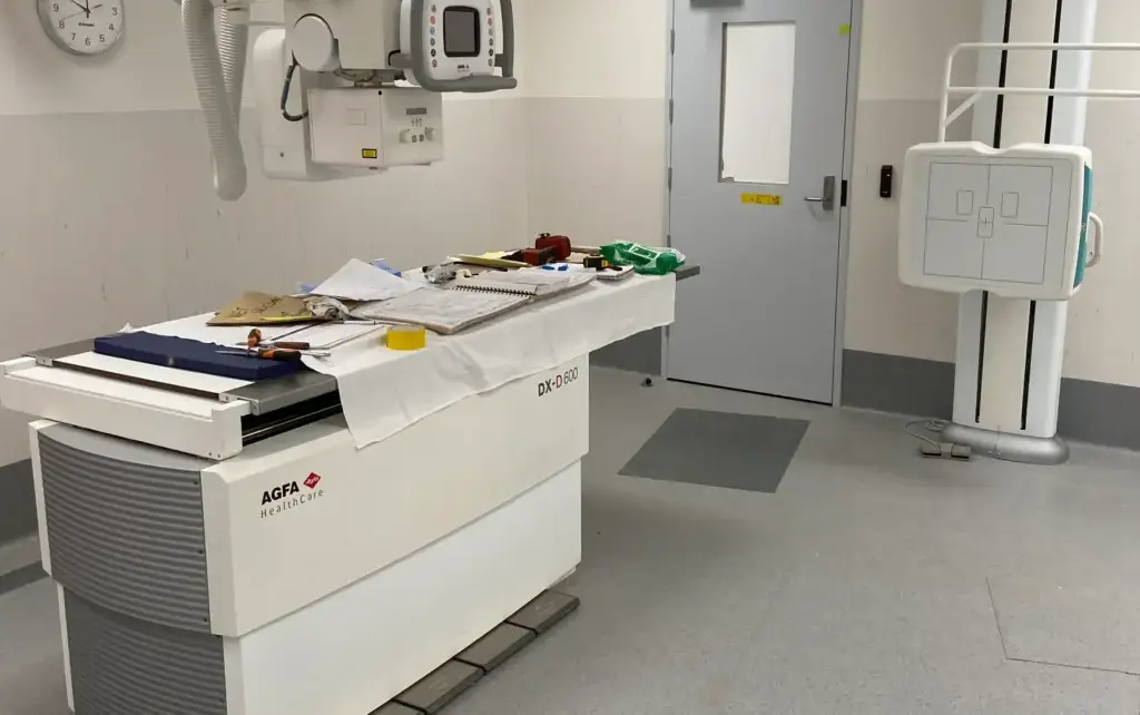 Medical imaging room with equipment and examination table