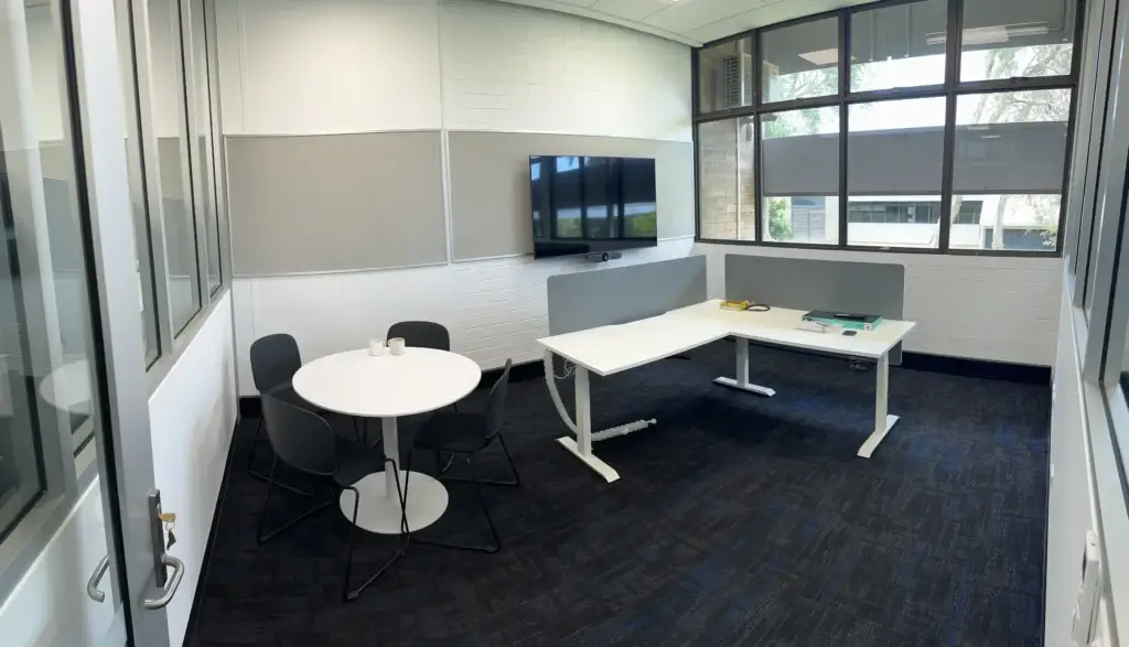 Modern meeting room with table and chairs
