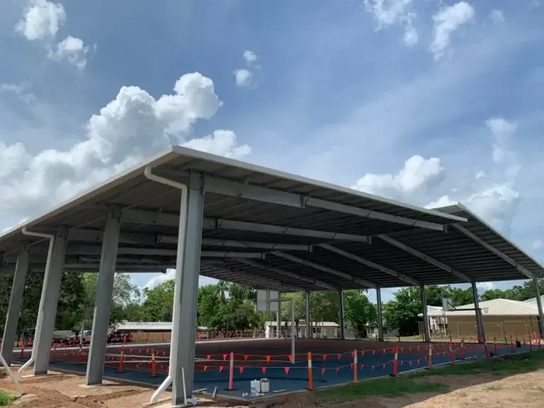 Large open sports shelter with blue flooring