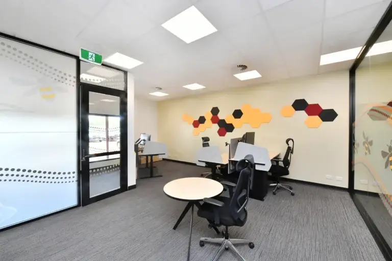 Modern office workspace with creative wall design.