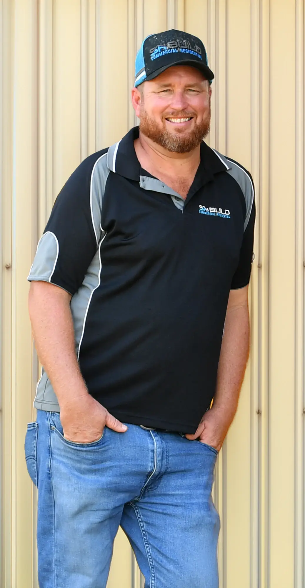 Smiling man in casual attire.