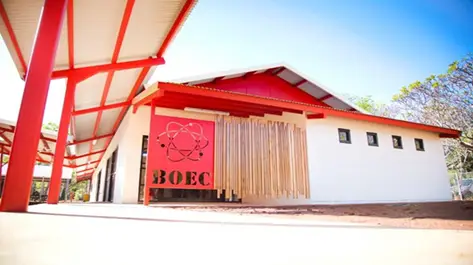 Modern white building with red roof and BOEC sign
